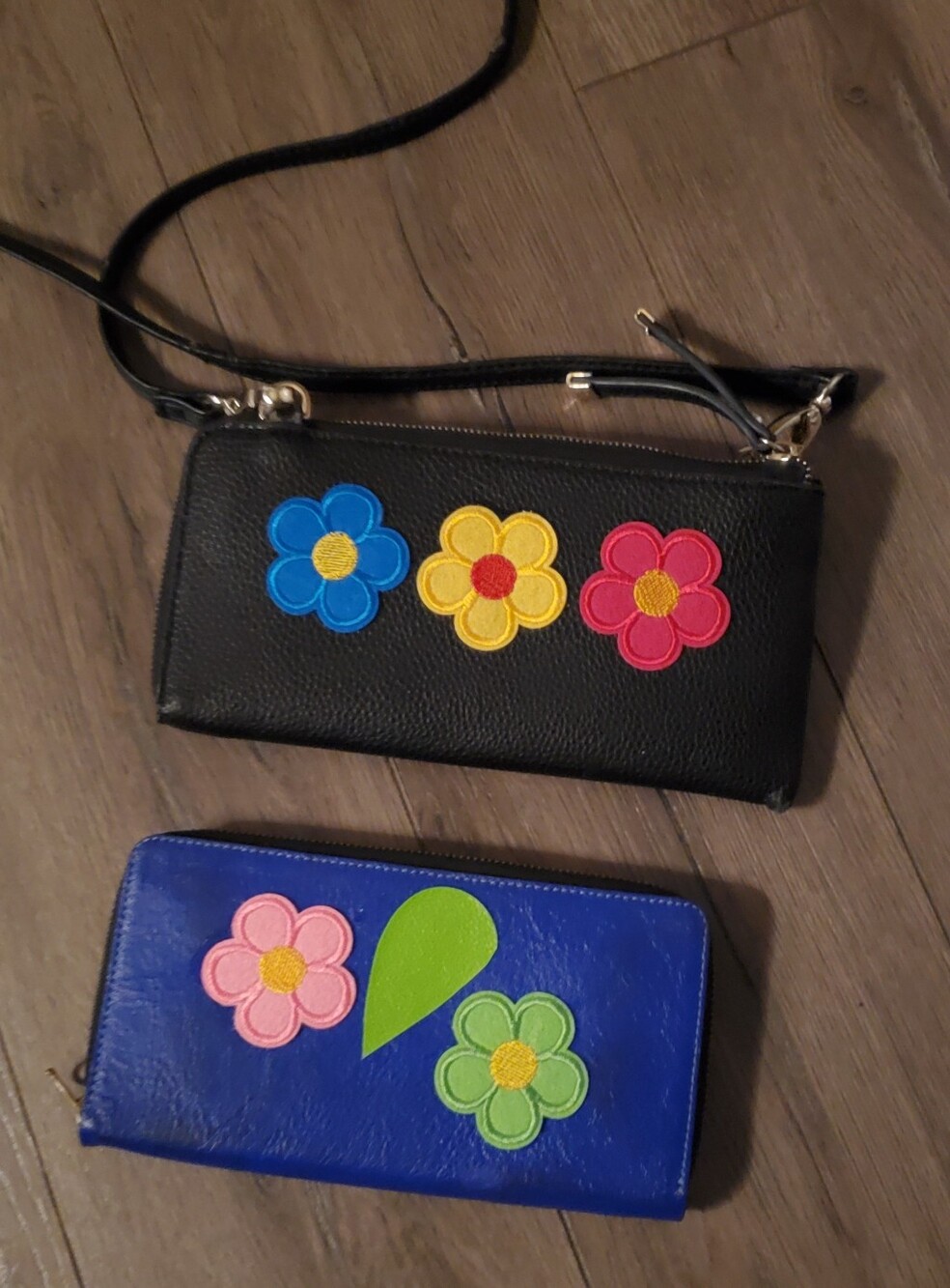 2 Large Wallets, 1 leather other faux keather with strap, flower design 9" and 8